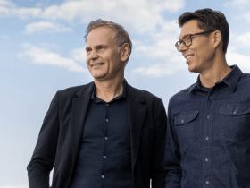 Rivian CEO RJ Scaringe with VW CEO Oliver Blume