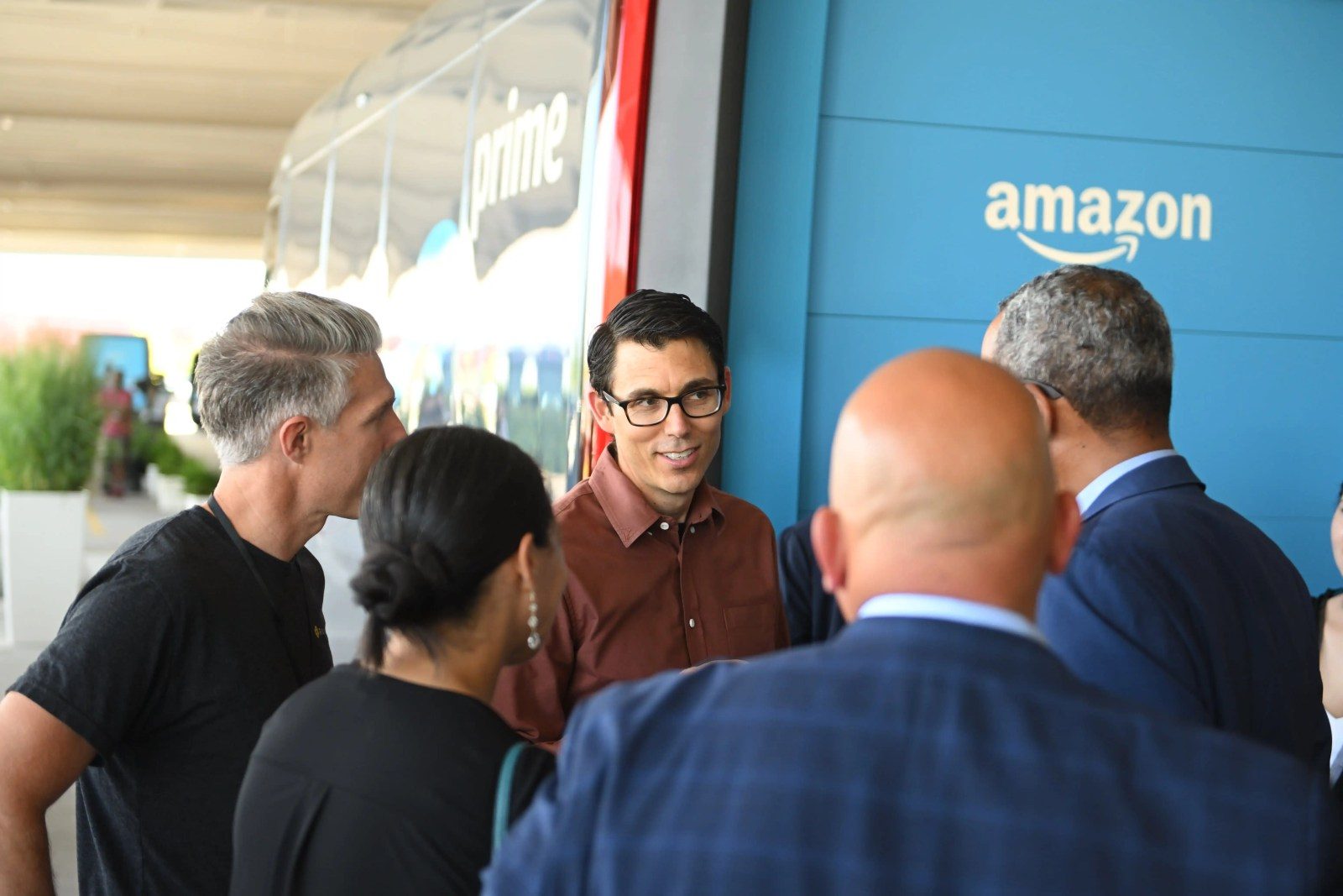 RJ Scaringe with EDVs in Amazon Delivery Center