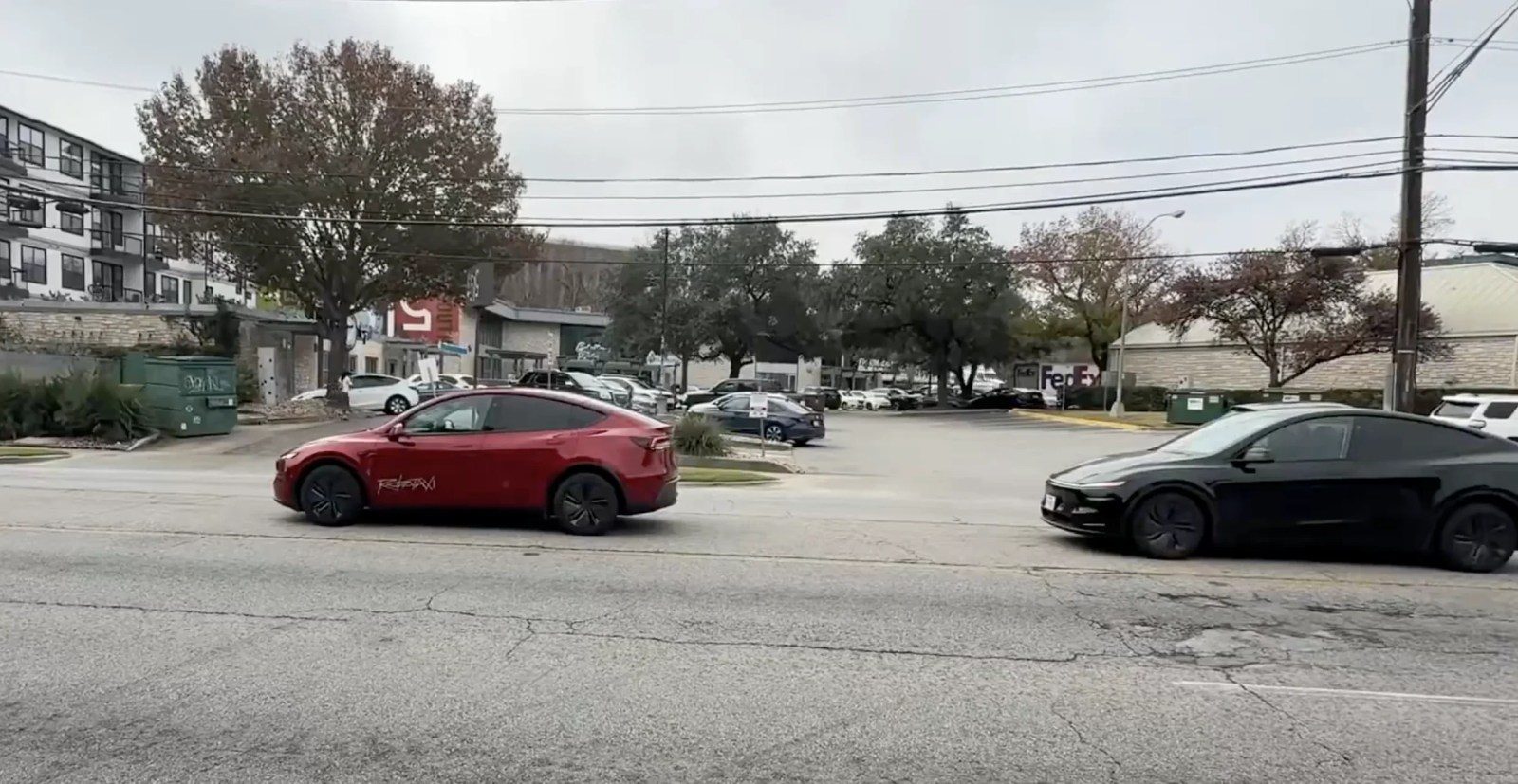 Tesla Robotaxi with chase car