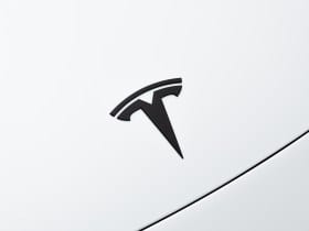 Tesla logo in a Model 3